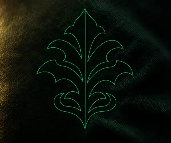 An ornamental crest drawn as line artwork, and the same crest sewn in green and gold thread
